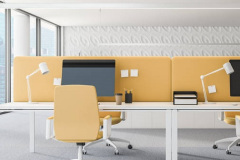 Interior of modern office with white walls, carpet on the floor, panoramic windows and white and yellow computer tables with yellow chairs. 3d rendering
